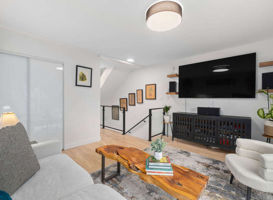This stunning living space boasts a modern design with a touch of natural elements.