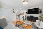 This stunning living space boasts a modern design with a touch of natural elements.