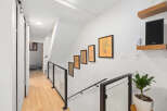 This stunning property features a bright and airy hallway with beautiful hardwood floors.