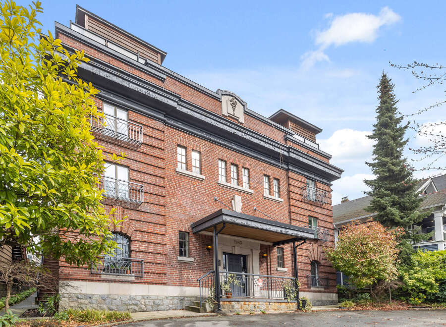 This stunning brick building offers a unique blend of classic architecture and modern living.