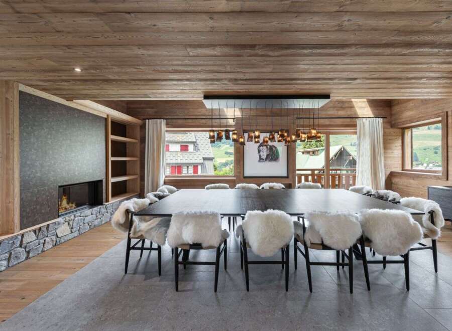 Experience luxury living in this stunning property, featuring a spacious dining area perfect for entertaining.