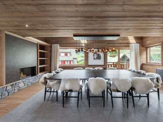 Experience luxury living in this stunning property, featuring a spacious dining area perfect for entertaining.