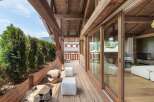 Experience luxury living in this stunning property featuring a spacious wooden deck and breathtaking views.
