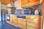 Discover the charm of this well-equipped kitchen, perfect for culinary enthusiasts.
