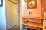 Discover this charming bathroom featuring a modern shower and a stylish sink area.