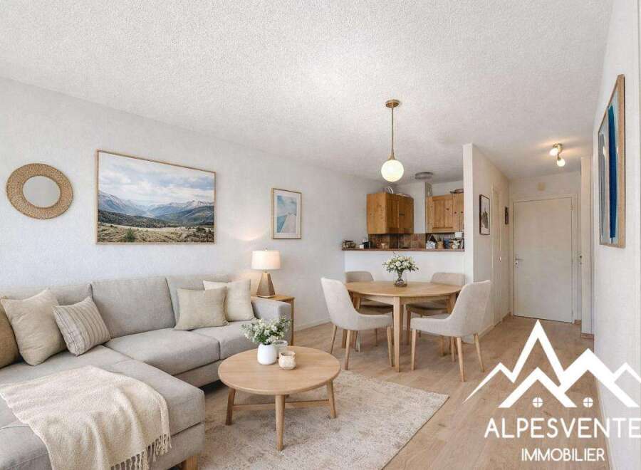 Discover this charming property featuring a cozy living area with a comfortable sectional sofa and a stylish round coffee table.