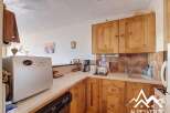 Discover the charm of this cozy kitchen, perfect for preparing delicious meals.