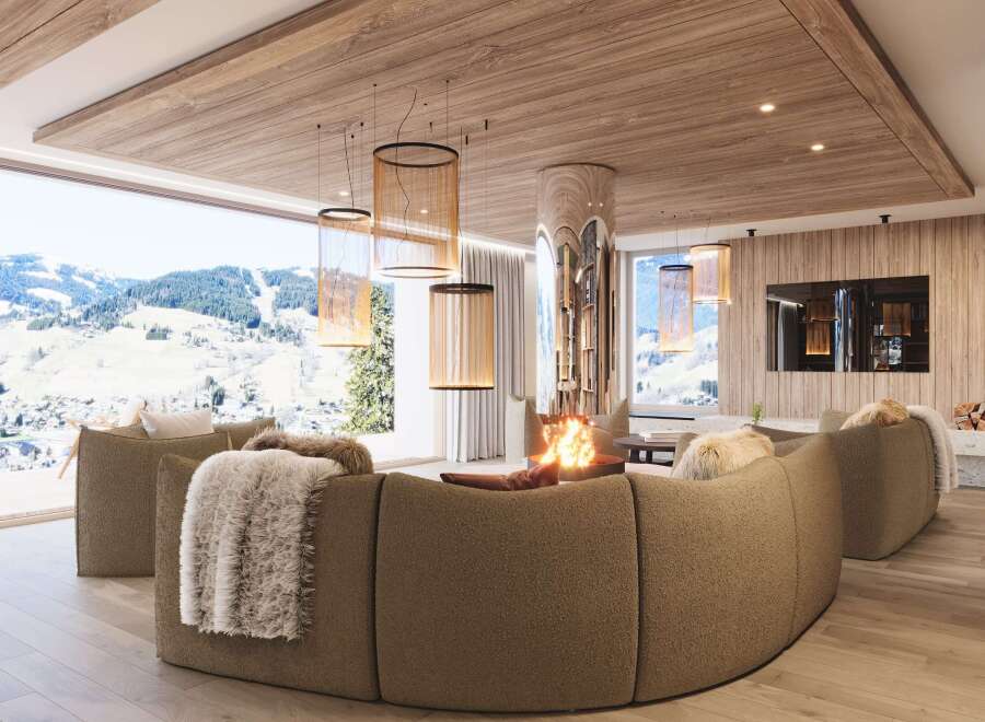 Experience luxury living in this stunning property, featuring a cozy living room with a fireplace and a breathtaking view of the mountains.