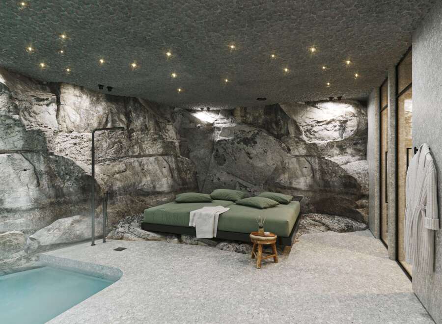Experience luxury in this unique property featuring a stunning rock-walled bedroom.