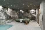 Experience luxury in this unique property featuring a stunning rock-walled bedroom.