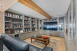 This luxurious living room boasts custom built-in shelving, perfect for displaying books and decor.