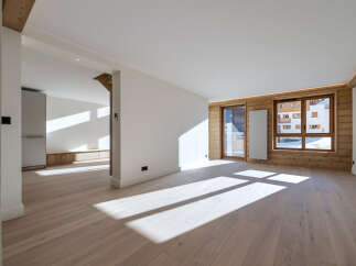 This stunning property boasts a bright and airy interior with beautiful wooden floors and walls, creating a warm and inviting atmosphere.