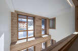 Experience the charm of this stunning property, featuring a unique wooden interior and expansive windows.