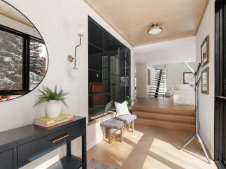 Step into luxury with this stunning entryway, showcasing a modern design with sleek lines and natural light.