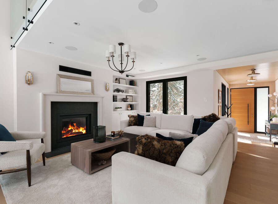 Experience luxury living in this stunning property featuring a cozy fireplace, perfect for chilly evenings.
