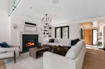 Experience luxury living in this stunning property featuring a cozy fireplace, perfect for chilly evenings.