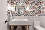 This stunning bathroom features a beautiful floral wallpaper that adds a touch of elegance and sophistication.