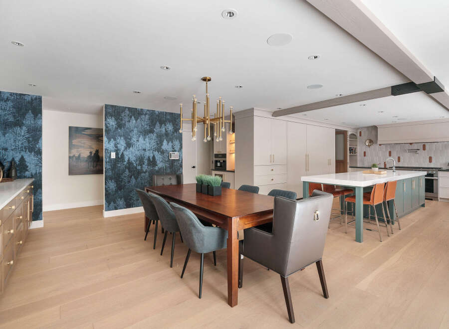 Step into luxury with this stunning open-concept kitchen and dining area.