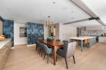 Step into luxury with this stunning open-concept kitchen and dining area.