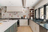 This stunning kitchen boasts a modern design with high-end finishes.