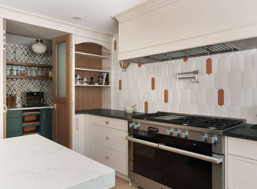 This stunning kitchen boasts a modern design with high-end appliances and ample storage.