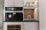 This stunning kitchen boasts a sleek, modern design with high-end appliances.