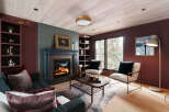 Experience the warmth and elegance of this stunning living room, featuring a cozy fireplace and stylish seating.