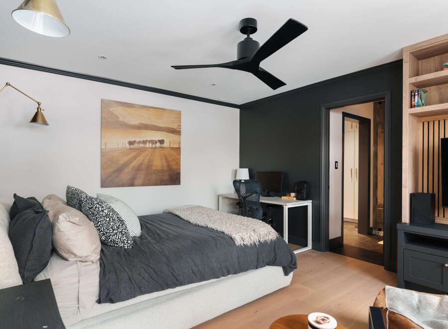This stylish bedroom offers a blend of comfort and modern design.