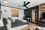 This stylish bedroom offers a blend of comfort and modern design.