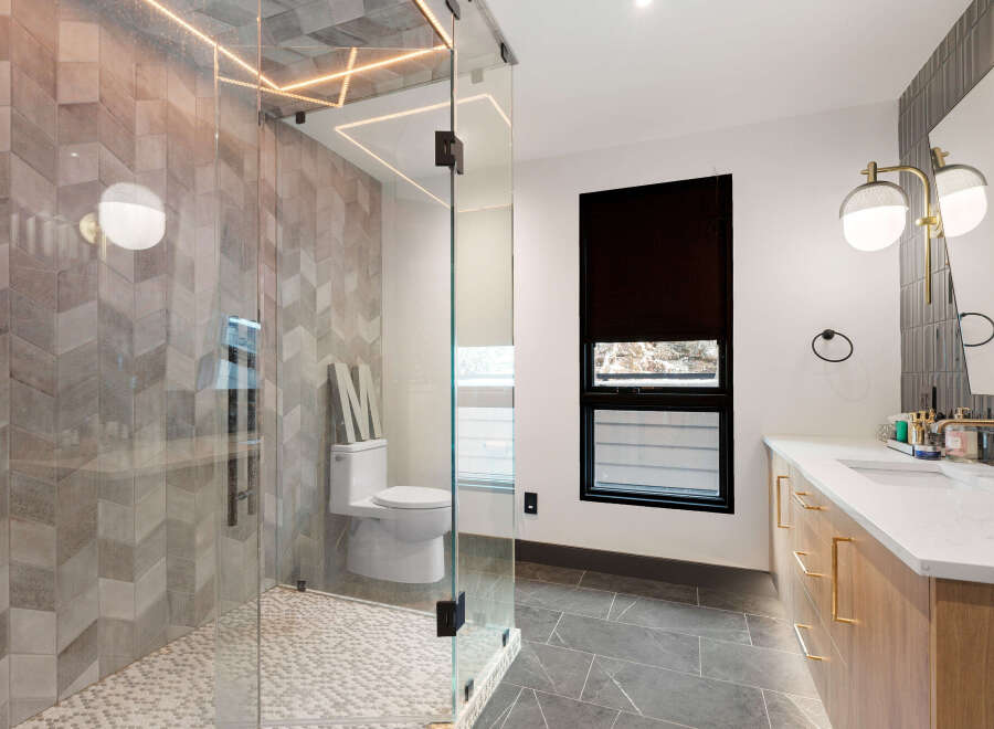 Step into luxury with this stunning bathroom! Featuring a modern glass shower, elegant tile work, and stylish lighting, this space is designed for relaxation.