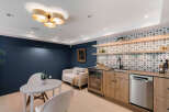 This stunning property boasts a beautifully designed bar area, perfect for entertaining guests.