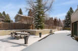Enjoy the serene beauty of this property's backyard, perfect for winter relaxation.