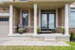 Welcome to this stunning property featuring a charming front porch with elegant columns and a welcoming entrance.