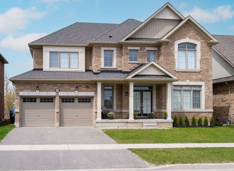 This stunning two-story brick home offers a perfect blend of elegance and comfort.