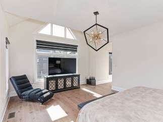 This stunning bedroom boasts a modern design with a touch of elegance.