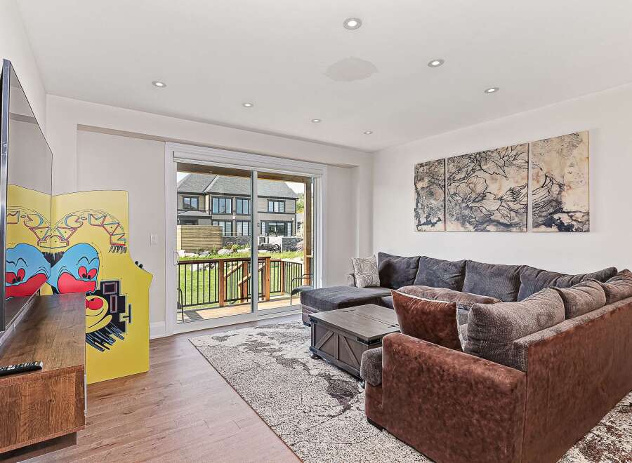 This stunning living room boasts a modern design with a cozy sectional sofa, perfect for relaxing.