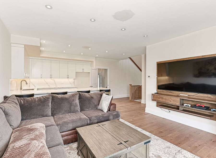 Step into luxury with this stunning living space! Featuring a modern kitchen with sleek cabinetry and a spacious layout, perfect for entertaining.