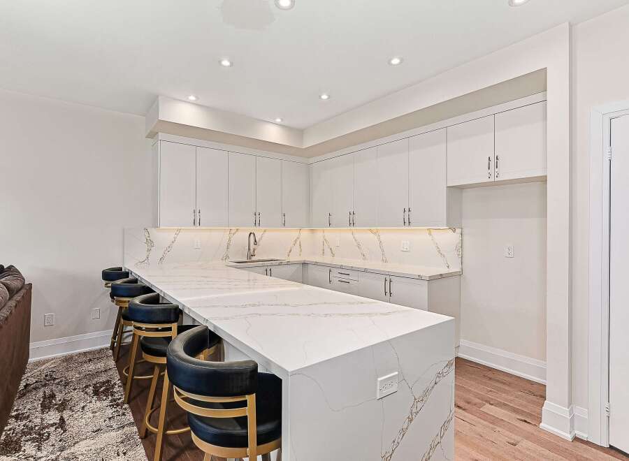 This stunning kitchen boasts a modern design with a large island, perfect for entertaining.