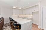 This stunning kitchen boasts a modern design with a large island, perfect for entertaining.