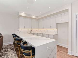 This stunning kitchen boasts a modern design with a large island, perfect for entertaining.