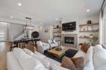 Step into luxury with this stunning property, boasting a modern living space with a cozy fireplace and elegant design.