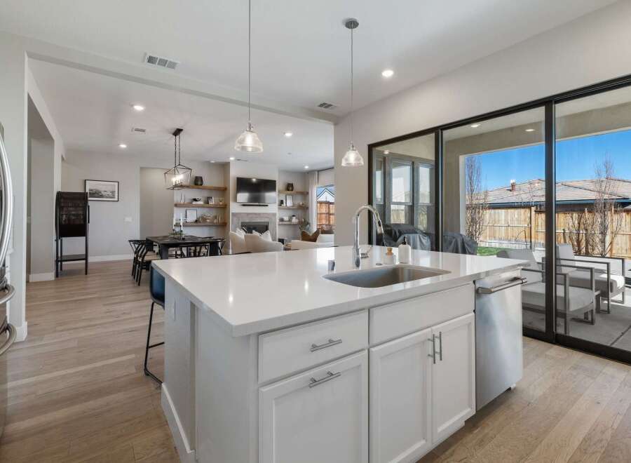 This stunning kitchen boasts a modern design with a spacious island, perfect for meal preparation and entertaining.