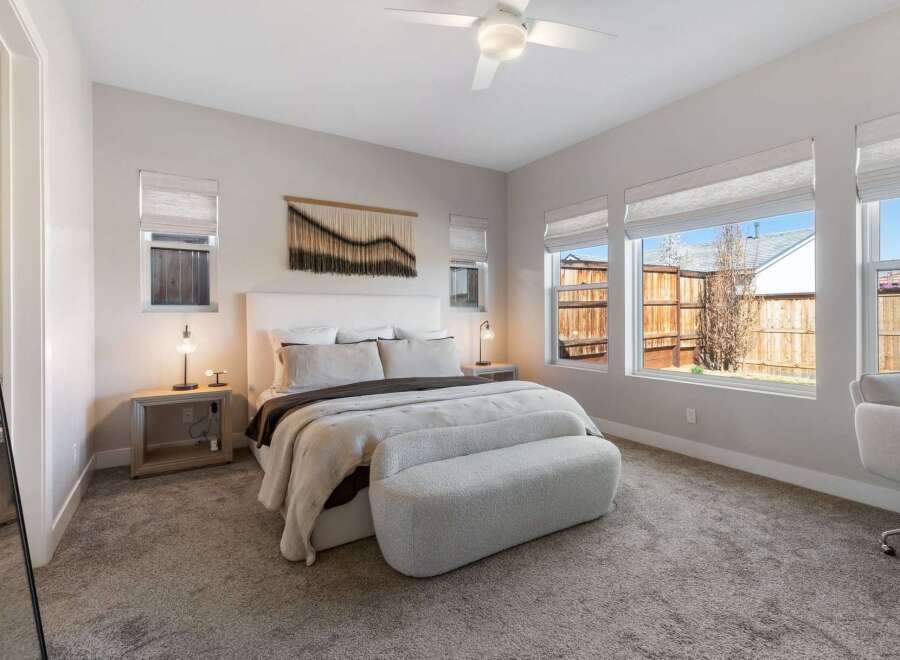 Step into this inviting bedroom, featuring a serene ambiance and modern design.