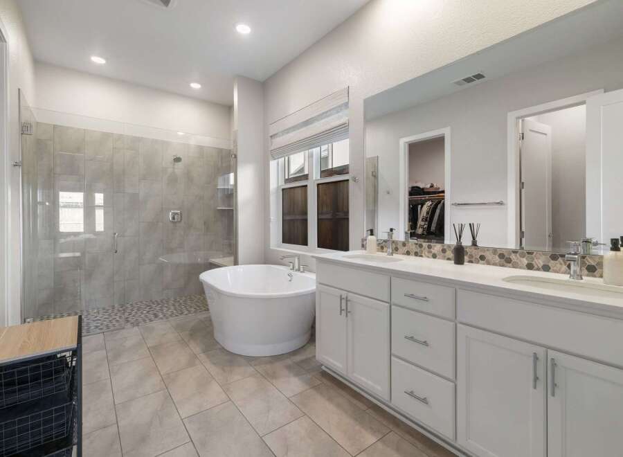 Indulge in luxury within this stunning bathroom, featuring a sleek, modern design.