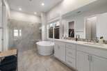 Indulge in luxury within this stunning bathroom, featuring a sleek, modern design.