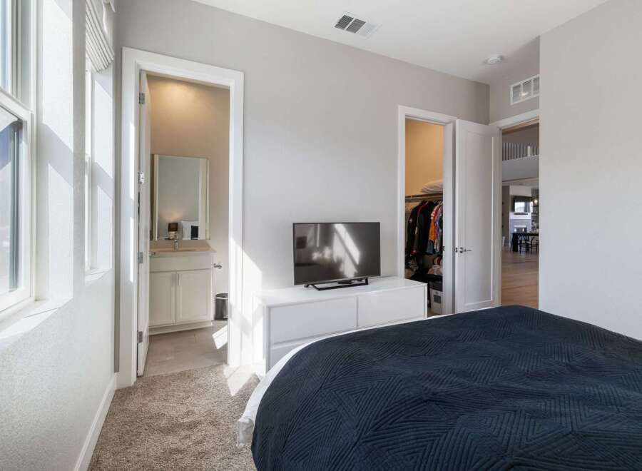 This stunning bedroom boasts a modern design with ample natural light.
