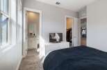 This stunning bedroom boasts a modern design with ample natural light.