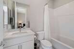 This stunning bathroom features a modern design with clean lines and a bright, airy feel.