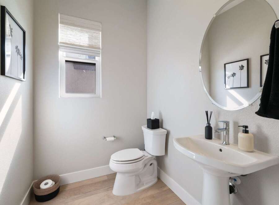 Step into a beautifully designed powder room, perfect for guests.