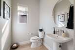 Step into a beautifully designed powder room, perfect for guests.